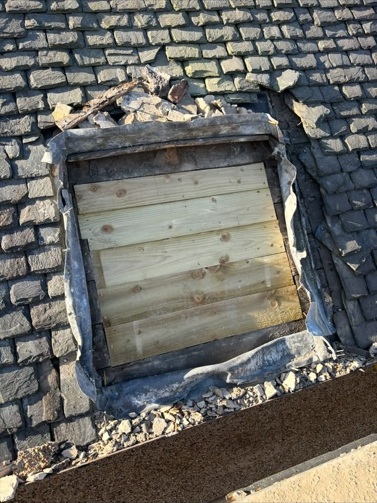 New timber boarding fitted where a chimney was removed from a slate roof, Edinburgh