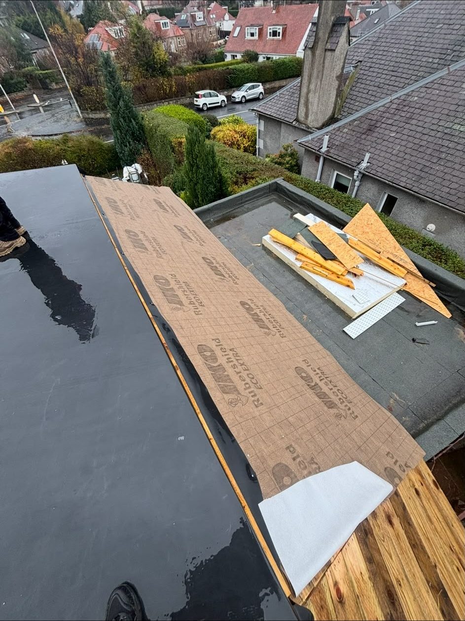 Half-finished felt flat roof showing new decking and underlay, Edinburgh