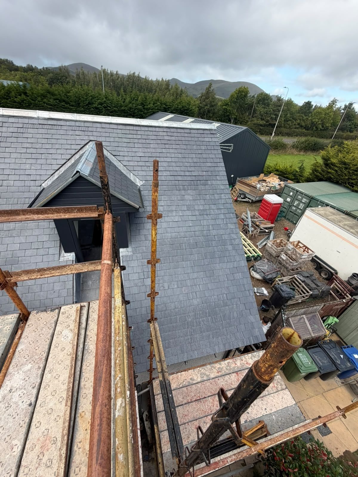 Roofing work on a slate roof with a dormer and scaffold, Edinburgh