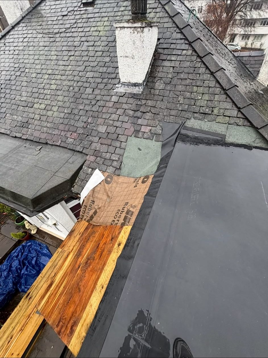 New felt flat roof laid beside a slate roof with new timber decking, Edinburgh