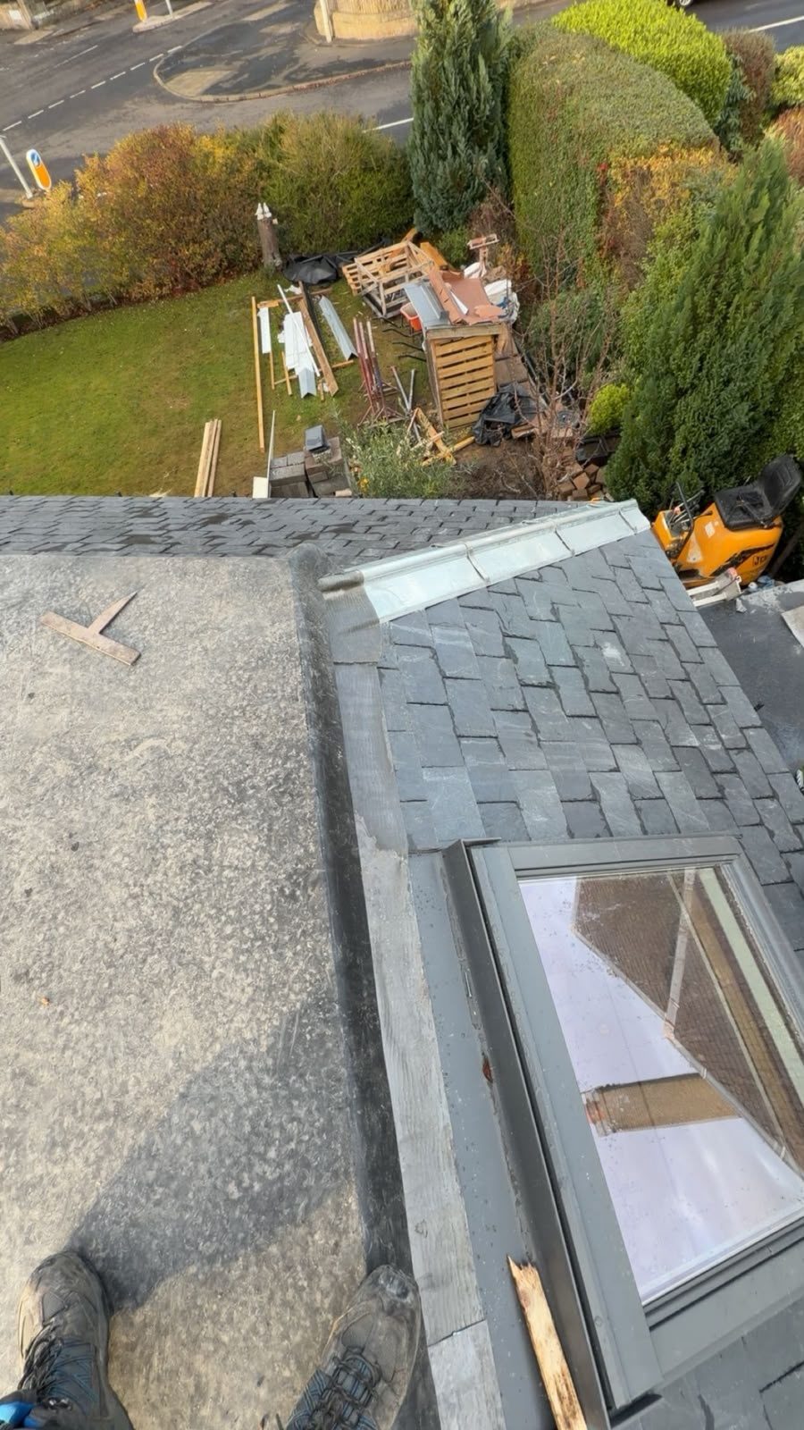 Velux window and slate roof next to a flat roof, Edinburgh