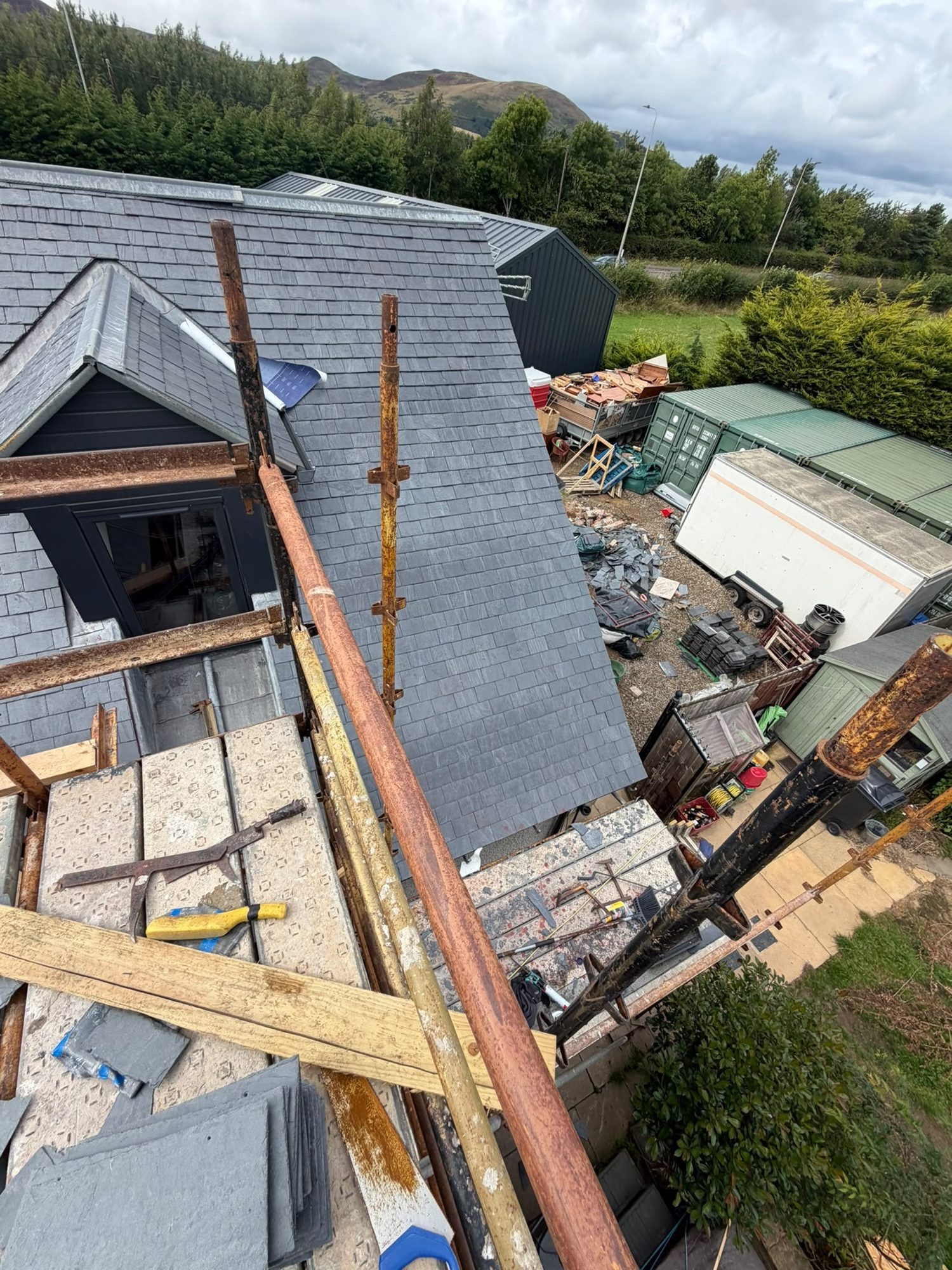 Slate roof and dormer viewed from the scaffold during roofing work, Edinburgh