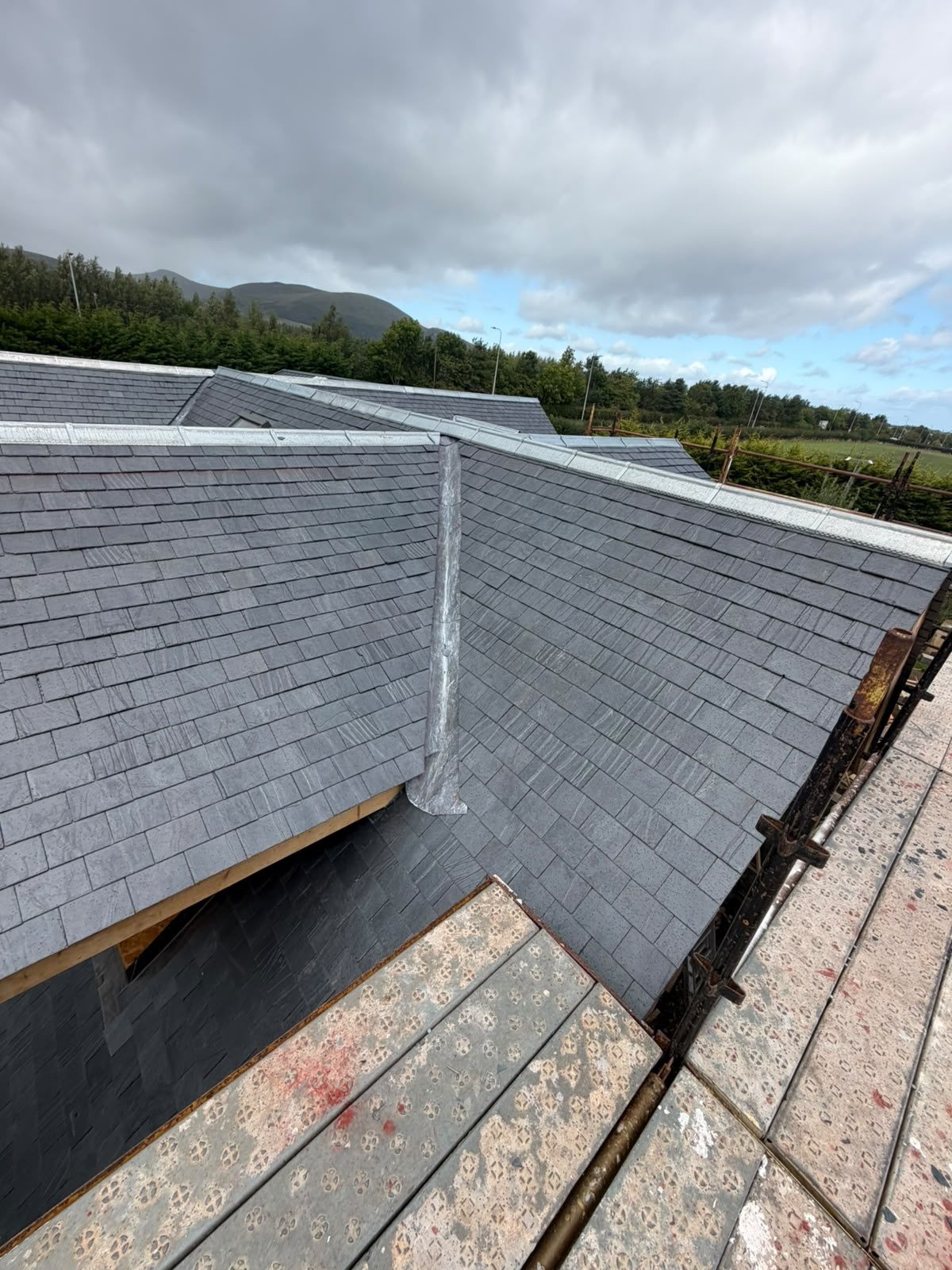 New slate roof with a lead valley near the Pentland Hills, Edinburgh